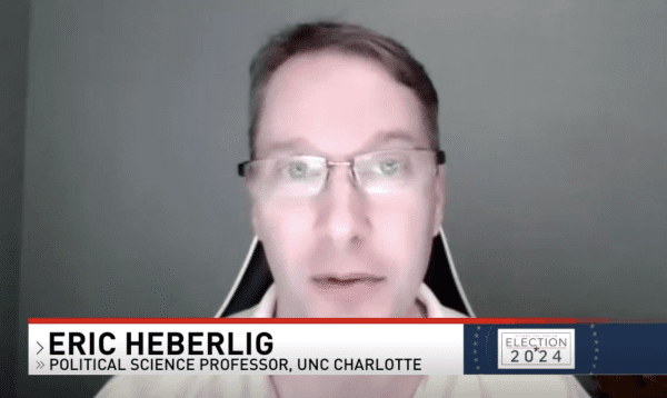 Screenshot of Eric Heberlig in the interview with the tv news chryon